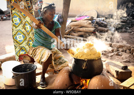 Woman prepares traditional corn porridge in Winneba, Ghana Stock Photo