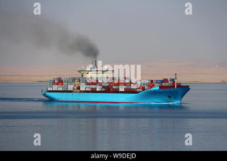 Container ship Maersk Karlskrona departing the Suez Canal and proceeding into the Red Sea. Stock Photo