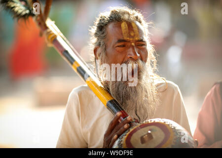 Sadhu performs a mantra at the Pushkar Camel Fair, Rajasthan. The fair is the largest camel fair in India. Stock Photo