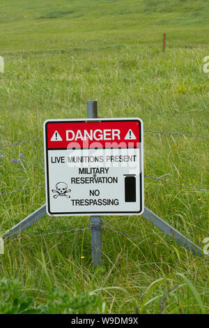 Warning sign for unexploded ordnance,  Adak Island, Aleutian Islands, Alaska Stock Photo