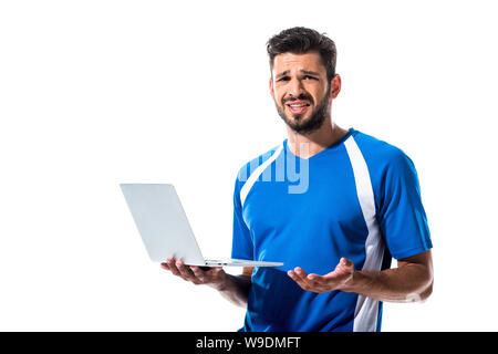 confused soccer player using laptop Isolated On White Stock Photo