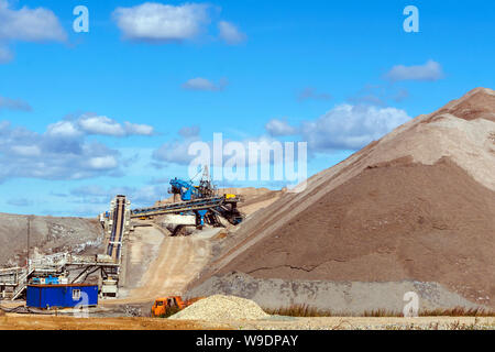 dumps of mined rock with a system of belt conveyors and spreaders, general view Stock Photo