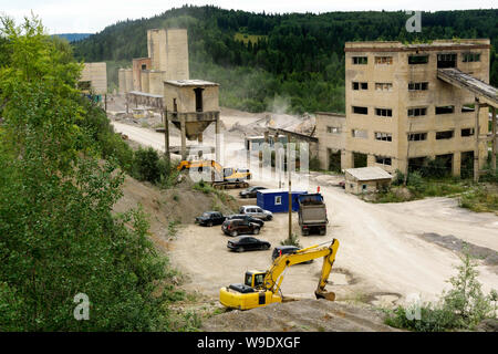dismantling and processing of old cement plant constructions on crushed stone Stock Photo