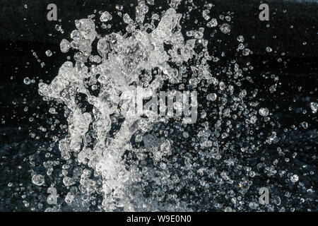 Water Splash on black background.Stylish water splash. Isolated on black background. Stock Photo