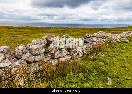 Stone wall in Iriah countyside in Western Ireland Stock Photo