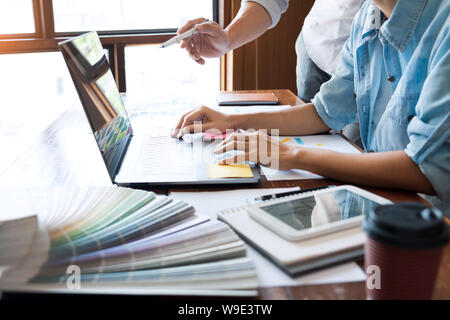 business technology concept, creative team designer choosing samples with UI/UX developing on sketch layout design mockup on smartphone application fo Stock Photo
