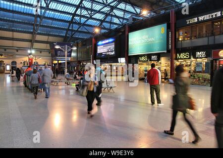 LIVERPOOL, UK - APRIL 20, 2013: People hurry at Lime Street station in Liverpool, UK. With 13.8m annual passengers (2012) it is the busiest station in Stock Photo