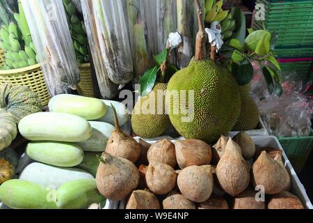 Bangkok marketplace - fresh fruit and vegetables including jackfruit. Stock Photo