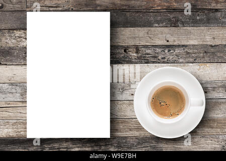 Flat lay Espresso coffee in coffee cup and white blank paper with copy-space on wooden table background. Stock Photo