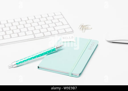 Desk with keyboard and mouse, calendar 2020 and a pen. Stock Photo