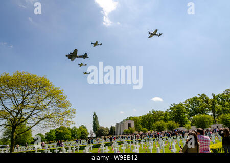 Second World War fighter planes and B-17 Flying Fortress bomber Sally B commemorative flypast over Cambridge American Cemetery, Madingley, UK Stock Photo