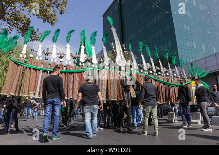 Shiites take to the streets during the holy month of Muharram to commemorate the death of the third Imam, Hussein, more than 1300 years ago in Karbala Stock Photo