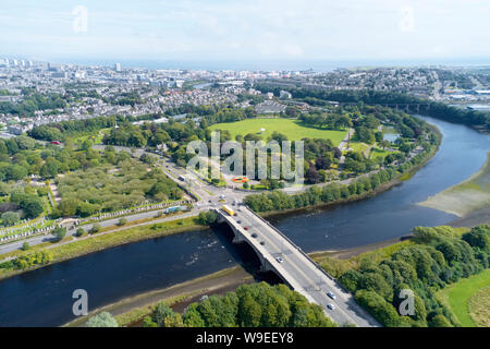 Aerial view of Aberdeen as River Dee flows in a curve to the North Sea showing Duthie Park with bridge and traffic from south Stock Photo