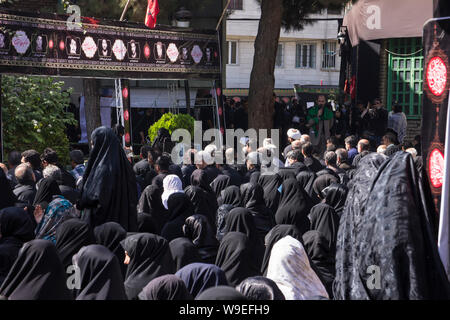 Shiites take to the streets during the holy month of Muharram to commemorate the death of the third Imam, Hussein, more than 1300 years ago in Karbala Stock Photo