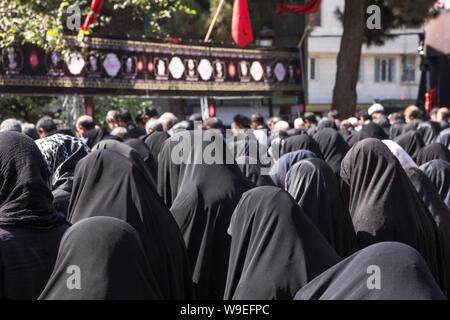 Shiites take to the streets during the holy month of Muharram to commemorate the death of the third Imam, Hussein, more than 1300 years ago in Karbala Stock Photo