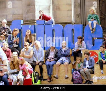 Edinburgh, Scotland, UK. 13th Aug, 2019. Edinburgh Fringe Festival was voted today as the number one attraction in the UK it saw performers enjoy the change in weather to take to the royal mile to promote their show and for street performers to entertain on their stage of the street. Credit: gerard ferry/Alamy Live News Stock Photo