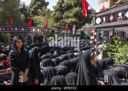 Shiites take to the streets during the holy month of Muharram to commemorate the death of the third Imam, Hussein, more than 1300 years ago in Karbala Stock Photo