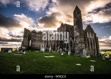 Cross on Rock of Cashel with cloudy background in Ireland Stock Photo