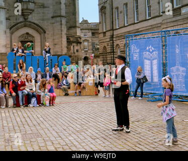 Edinburgh, Scotland, UK. 13th Aug, 2019. Edinburgh Fringe Festival was voted today as the number one attraction in the uk it saw performers enjoy the change in weather to take to the royal mile to promote their show and for street performers to entertain on their stage of the street. Credit: gerard ferry/Alamy Live News Stock Photo