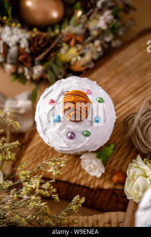 Easter composition with willow and willow lights with Easter eggs and traditional Easter cakes. Holiday concept.Easter still life. Stock Photo