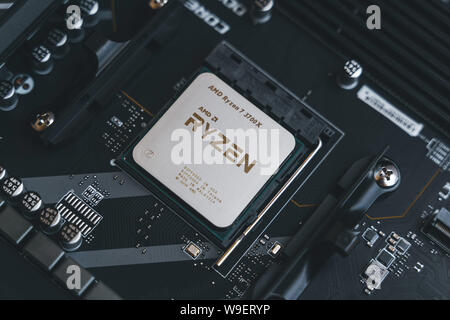 AMD Ryzen 3700x processor in the X570 motherboard socket. New Zen 2, 7 nanometer desktop CPU by AMD. Very popular 3rd generation Ryzen 3000 processor. Stock Photo