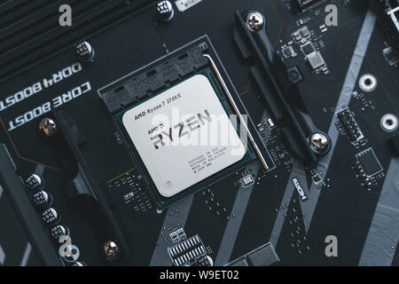 AMD Ryzen 3700x processor in the X570 motherboard socket. New Zen 2, 7 nanometer desktop CPU by AMD. Very popular 3rd generation Ryzen 3000 processor. Stock Photo