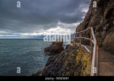 spectacular cliff walk at the Blackhead Lighthouse, Co Antrim, Northern Ireland Stock Photo