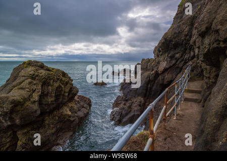 spectacular cliff walk at the Blackhead Lighthouse, Co Antrim, Northern Ireland Stock Photo