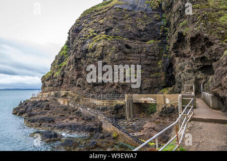 spectacular cliff walk at the Blackhead Lighthouse, Co Antrim, Northern Ireland Stock Photo