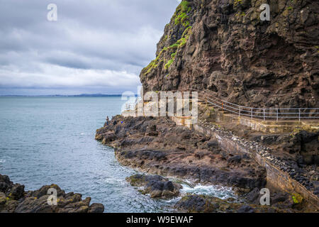 spectacular cliff walk at the Blackhead Lighthouse, Co Antrim, Northern Ireland Stock Photo