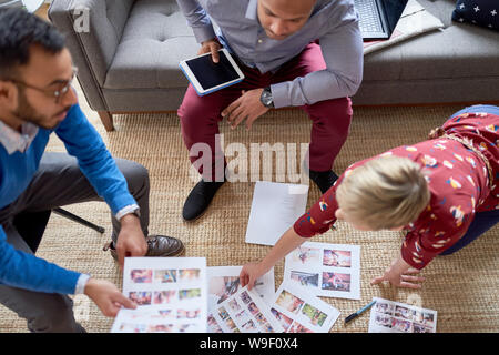 Multi-ethnic team of creative millenials collaborating on a brainstorm project Stock Photo
