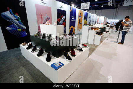 Las Vegas, USA. 12th Aug, 2019. A cameraman works at the China Footwear Pavilion at the Las Vegas MAGIC Show in Las Vegas, the United States, on Aug. 12, 2019. As one of the largest and most influential fashion trade shows in America, the MAGIC Show is not only a fashion trade affair but a display of manufacturing resources from around the world. Credit: Li Ying/Xinhua/Alamy Live News Stock Photo