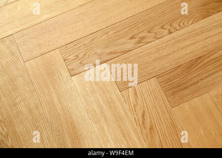 Seamless wood parquet texture, chevron sand color. Stock Photo