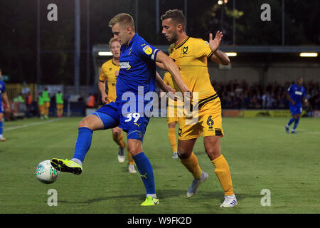 Kingston Upon Thames, UK. 13th Aug, 2019. Joe Pigott of AFC Wimbledon (L) in action with Baily Cargill of Milton Keynes Dons (R). Carabao cup, EFL Cup 1st round match, AFC Wimbledon v MK Dons at the Cherry Red Records Stadium in Kingston upon Thames, Surrey on Tuesday 13th August 2019. this image may only be used for Editorial purposes. Editorial use only, license required for commercial use. No use in betting, games or a single club/league/player publications. pic by Steffan Bowen/Andrew Orchard sports photography/Alamy Live news Credit: Andrew Orchard sports photography/Alamy Live News Stock Photo