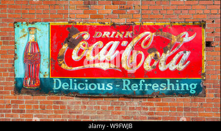 Washington, Palouse Region, Rosalia, old rusty Coca-Cola sign on red brick wall Stock Photo