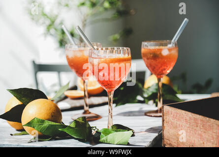 Aperol Spritz cocktail in glasses with fresh oranges Stock Photo