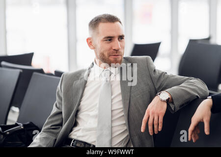 happy businessman discussing with colleague new business plan. Stock Photo