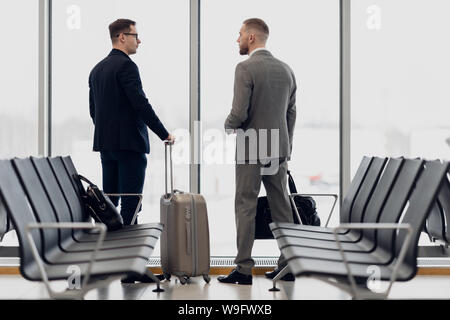 happy businessman discussing with colleague new business plan. Stock Photo