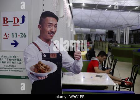 Hong Kong, CHINA. 14th Aug, 2019. A man rest and checking his smartphone inside the Restaurant at the HK International Airport awaiting for next available flight.Aug-14, 2019 Hong Kong.ZUMA/Liau Chung-ren Credit: Liau Chung-ren/ZUMA Wire/Alamy Live News Stock Photo