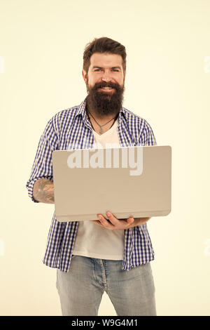 Happy man with notebook. Searching for new job. Bearded man using notebook. Bearded happy man surfing inet on notebook. Job searching. I need job. Best offer. Job search. In search of inspiration. Stock Photo