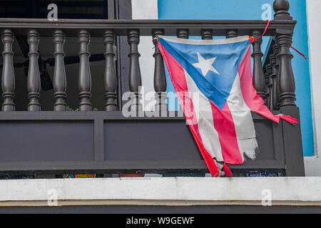 Puerto Rico protests - a tattered Puerto Rico flag flies in old San Juan Puerto Rico -  a torn Puerto Rican flag flaps in the breeze Stock Photo