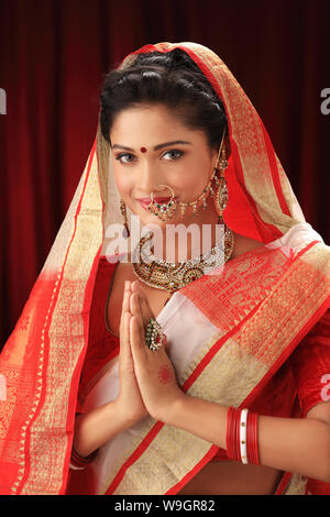 Indian bride welcoming with hands joined Stock Photo