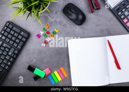 The layout of school supplies on a dark gray background. The view from the top. Back to school. Flat lay Stock Photo