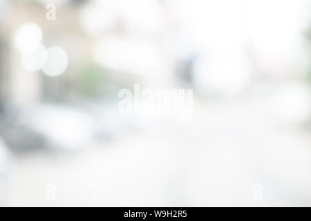 Abstract black and white bright bokeh interior background with white table top for backdrop design, bokeh composition for , website, magazine or