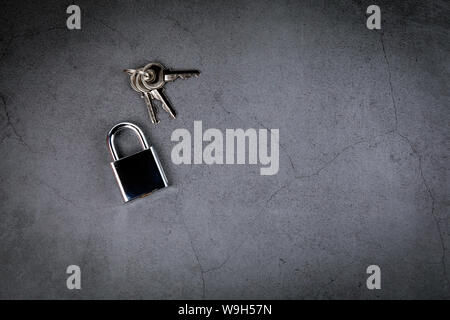 Padlock on gray concrete background. Privacy and Internet security concept Stock Photo