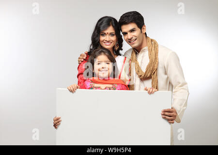 Family showing a placard Stock Photo