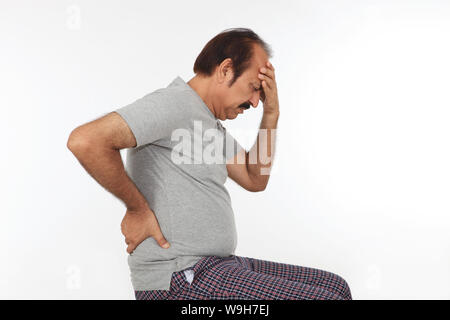 Mature man suffering from headache Stock Photo