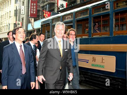 Prince Philippe of Belgium, front, followed by Belgian film director Marc-Henri Wajnberg, right, and other officials visits the scene of the productio Stock Photo