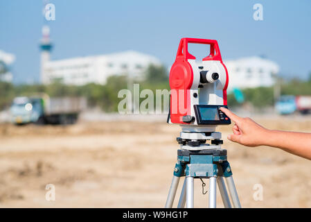 Civil engineer use surveyor equipment theodolite checking construction site for new Infrastructure project. photo concept for engineering work. Stock Photo