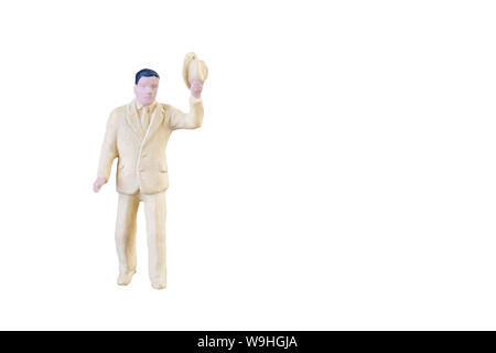 Close up of Miniature people isolated with clipping path on white background. Stock Photo